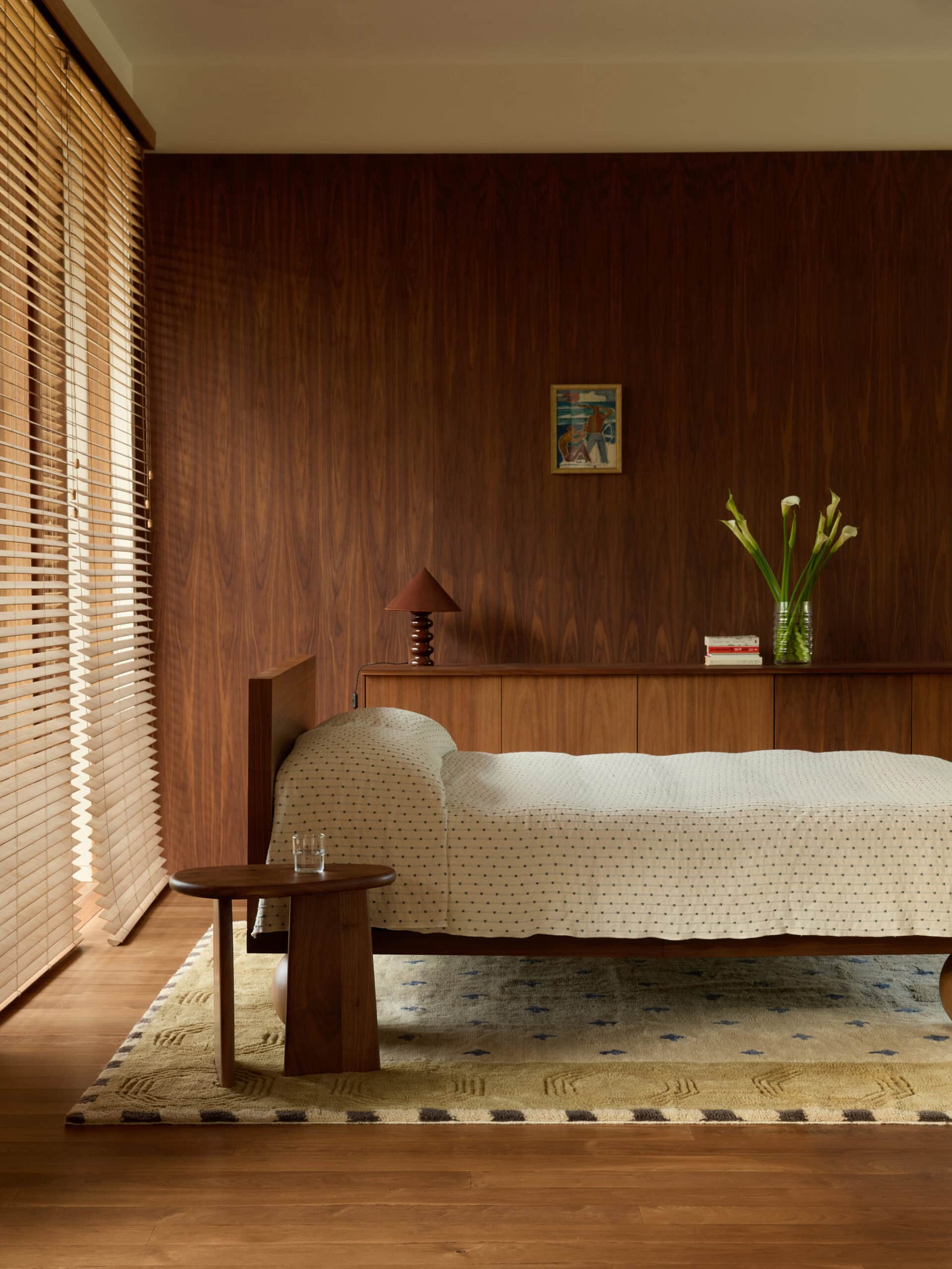 Dune rug in Tan by Olive Cooke x Double Studio in a timber-panelled bedroom