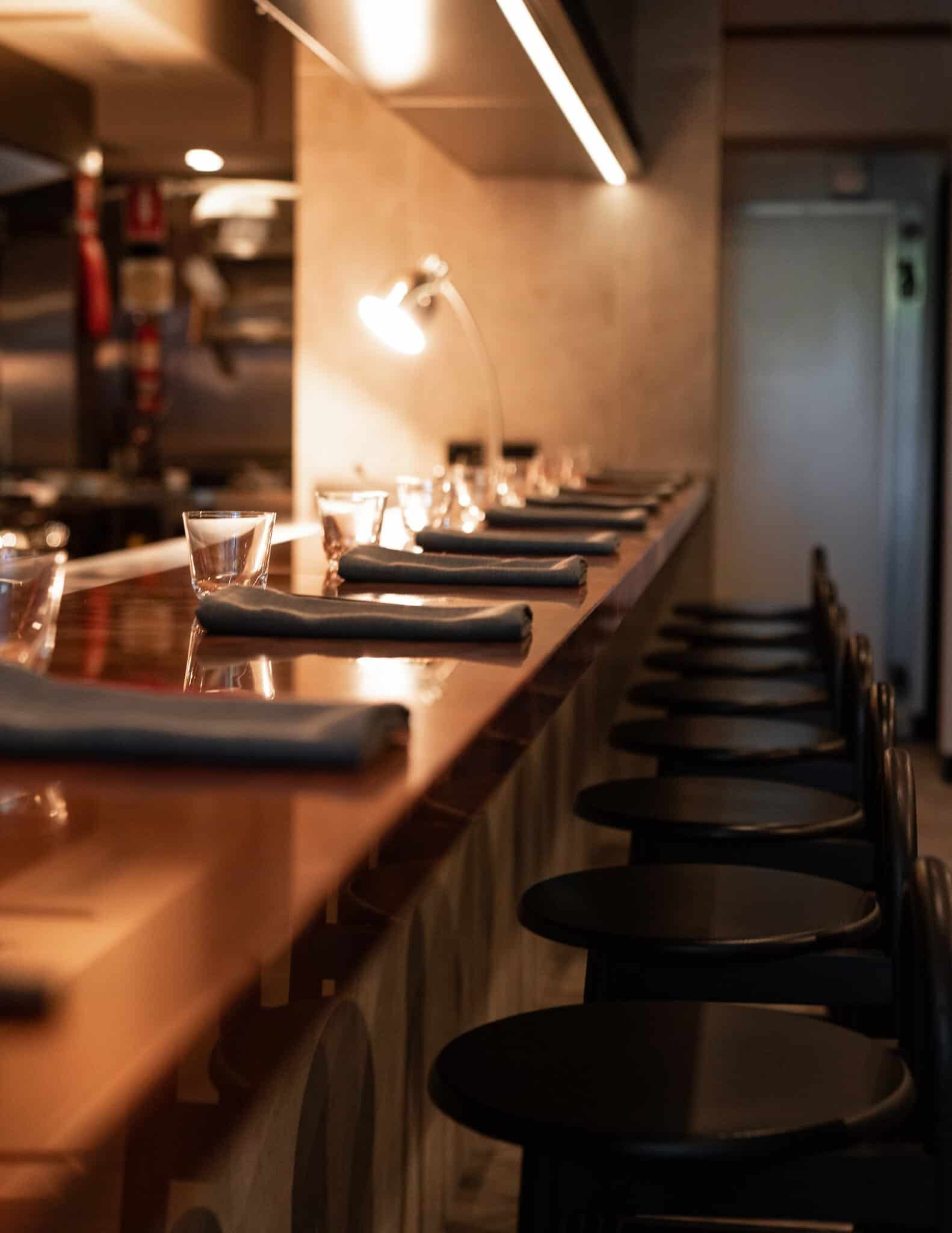 10-seat timber bar with stools facing the open kitchen at Restaurant Ka, Darlinghurst Sydney