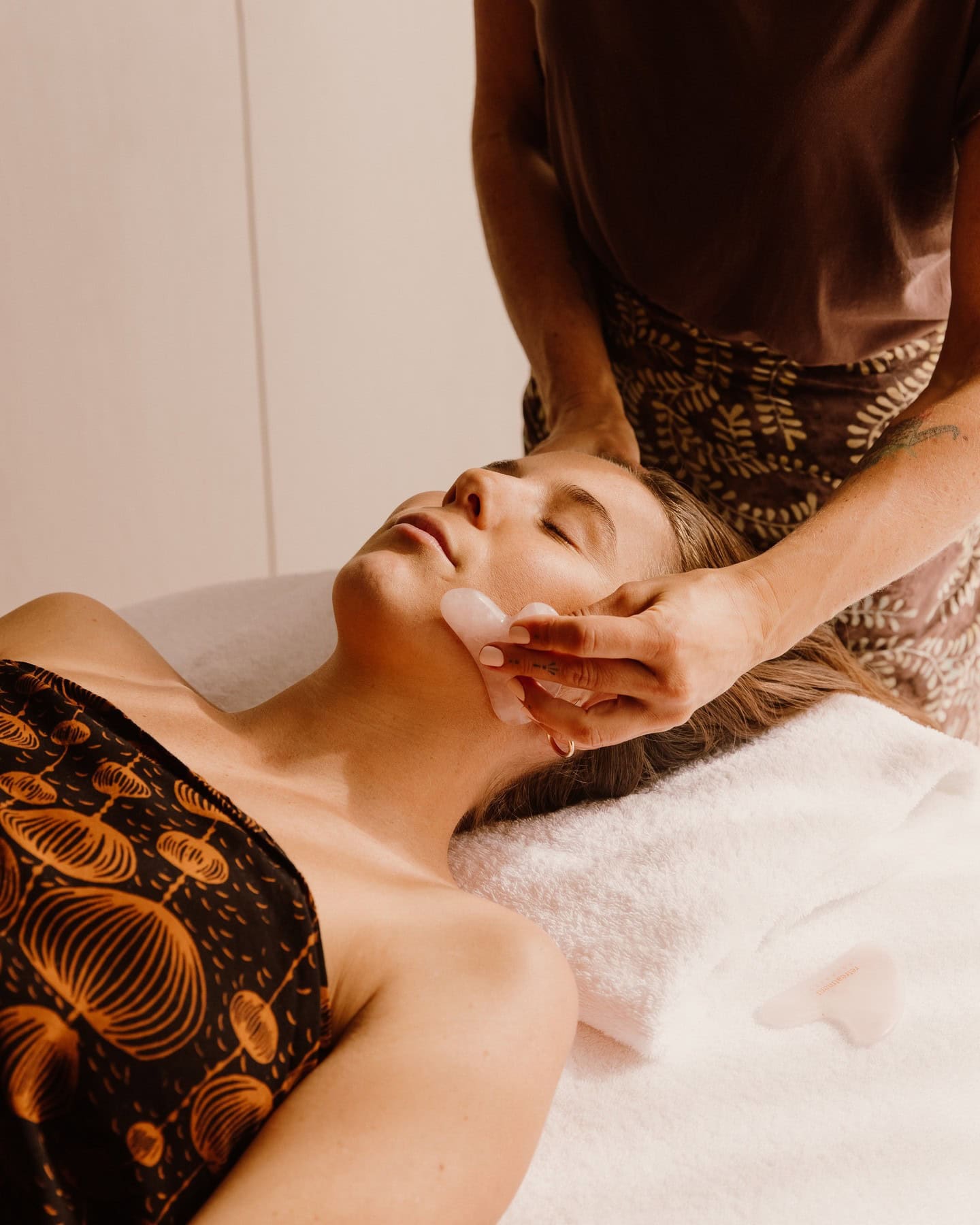 A woman receiving a facial at Gaia Retreat NSW