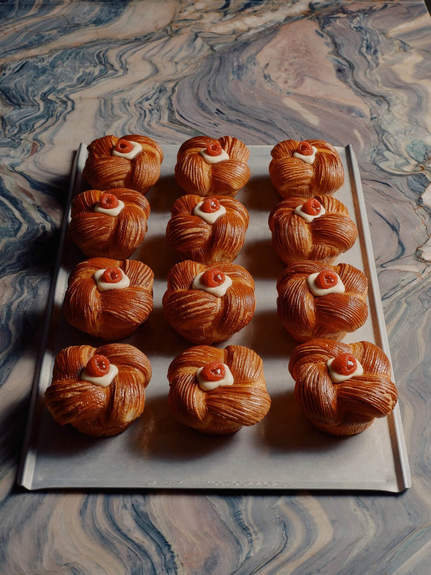 A tray of raspberry croissant buns at Idle Bakery in Brisbane.