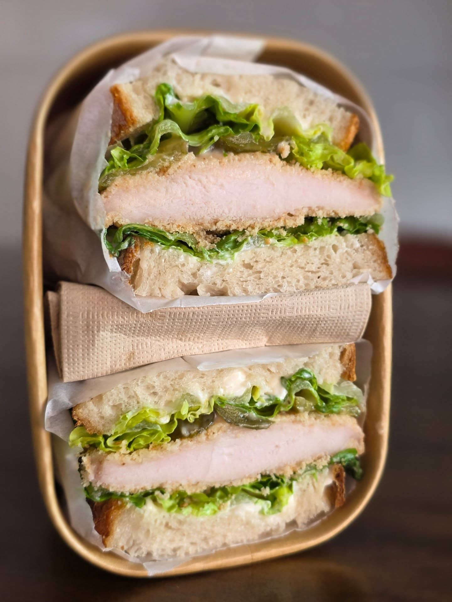 A cross section of a schnitzel sandwich from Danny's Bread in Brisbane.