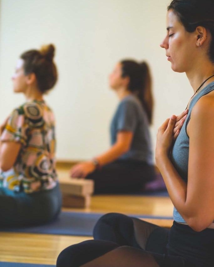 A class of people practising breathwork at Happy Buddha Retreats in the Blue Mountains.